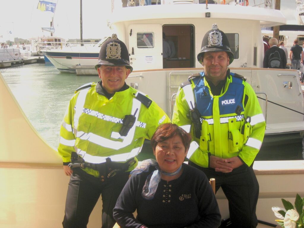 . Friendly British coppers at Southampton boat show with Louisa from Taiwan.