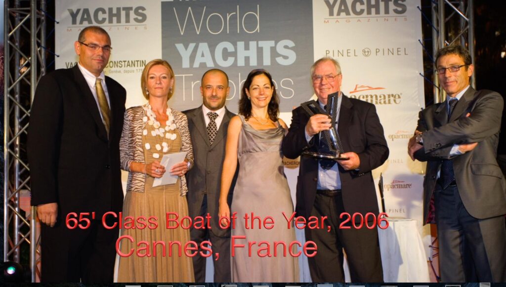 Tony and Nicky accepting award in Cannes, France, for Best boat in her class for the Year 2006 for Fleming 65.