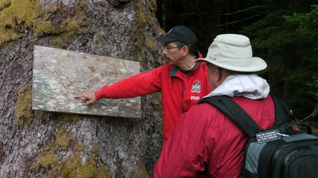 Frank explains map of village