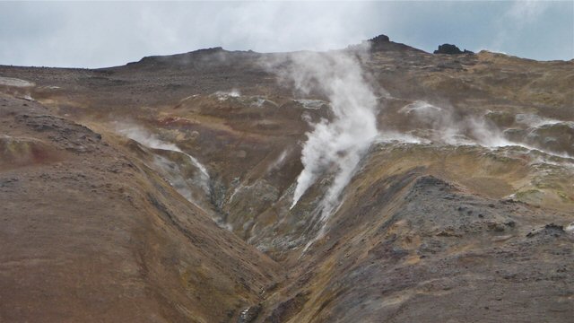 Steam issuing from mountain