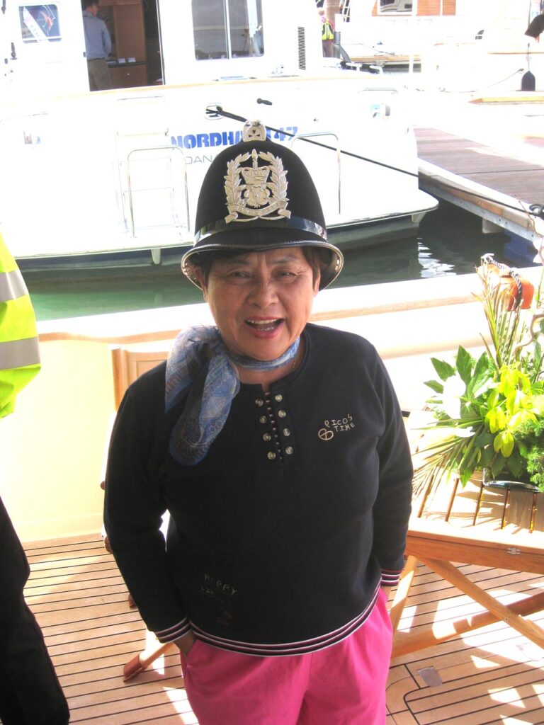 Louisa wearing cops helmet.