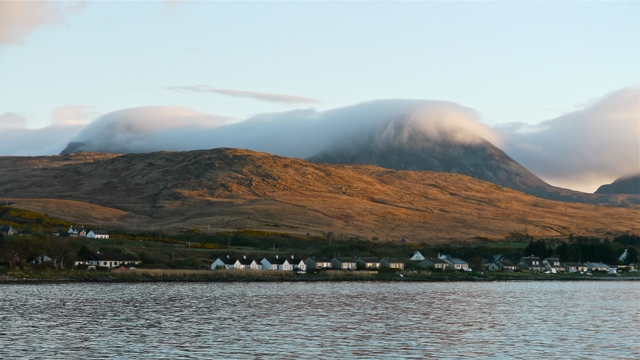 Morning mist on Paps of Jura with Craighouse in foreground