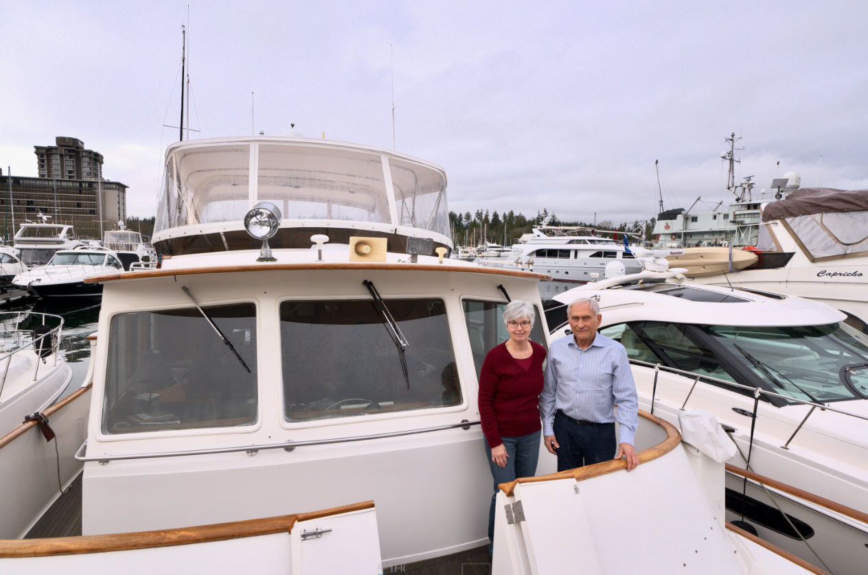 owners standing near bow of fleming 50