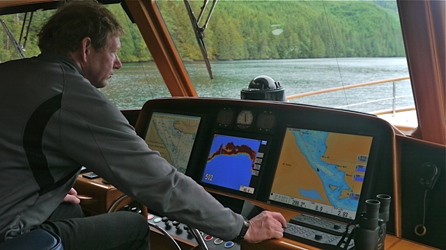 Chris in pilothouse leaving Dent Island