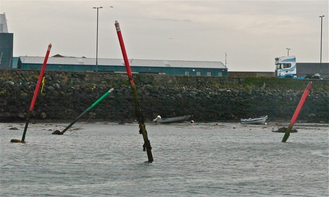 Wonky nav poles at entrance to Howth Marina